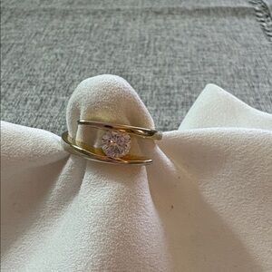 Elegant Gold  Women's Ring with Clear Center Stone. Approximate size 8.75